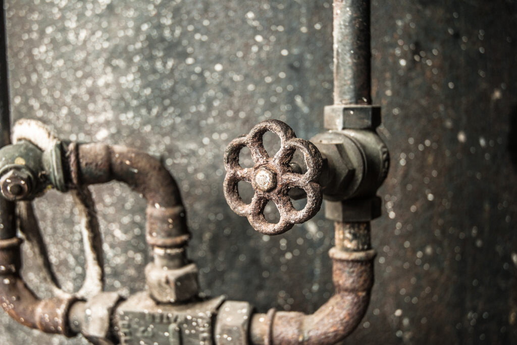 Old, rusty Industrial steam boiler tap