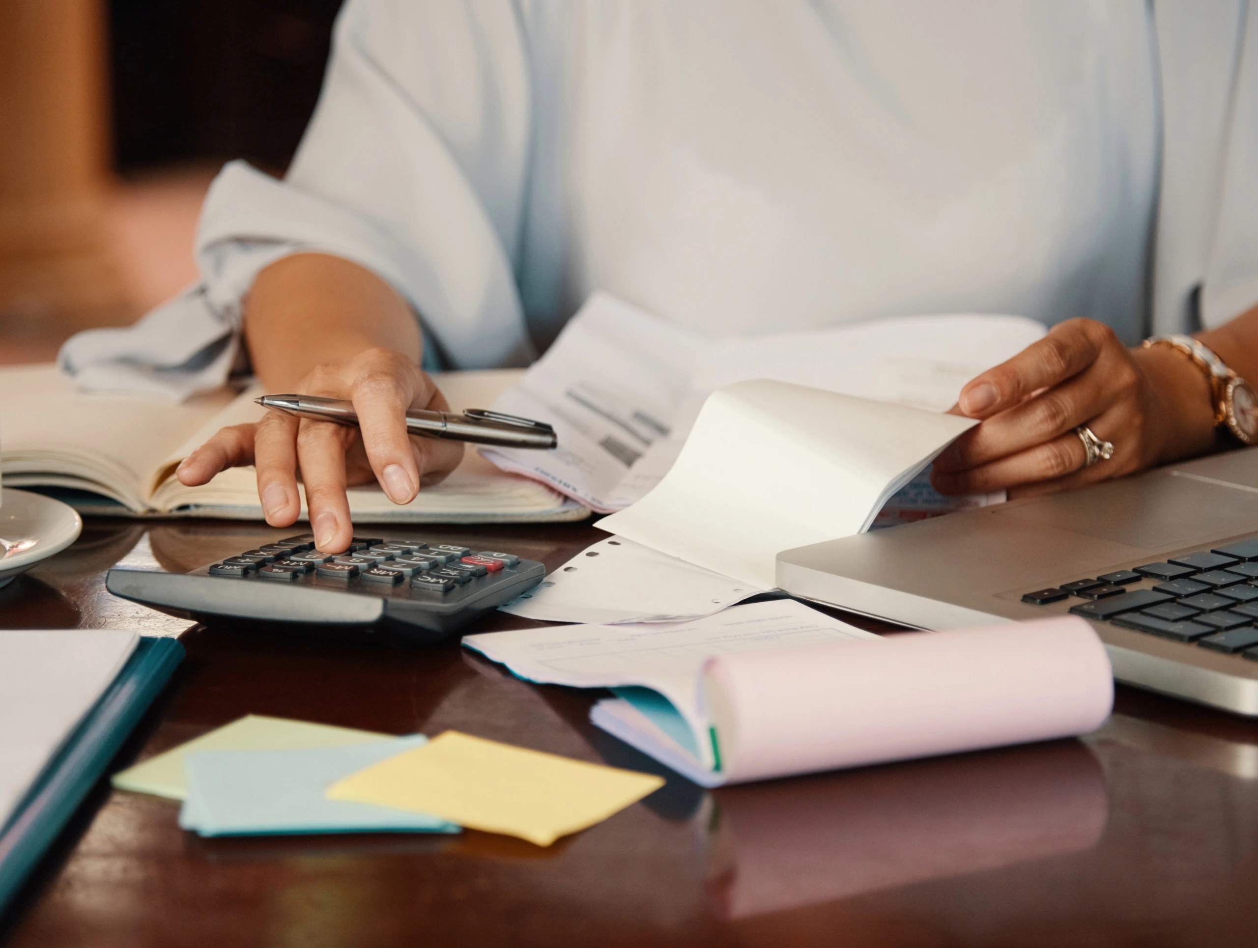 Person calculating expenses